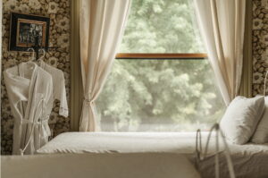 photo of hotel room with bed and robes